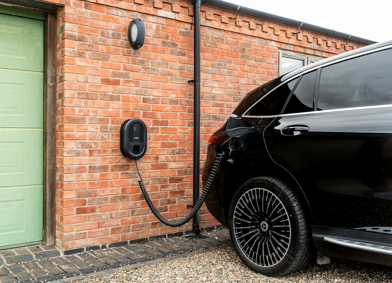 Electric vehicle charging at a home charging station